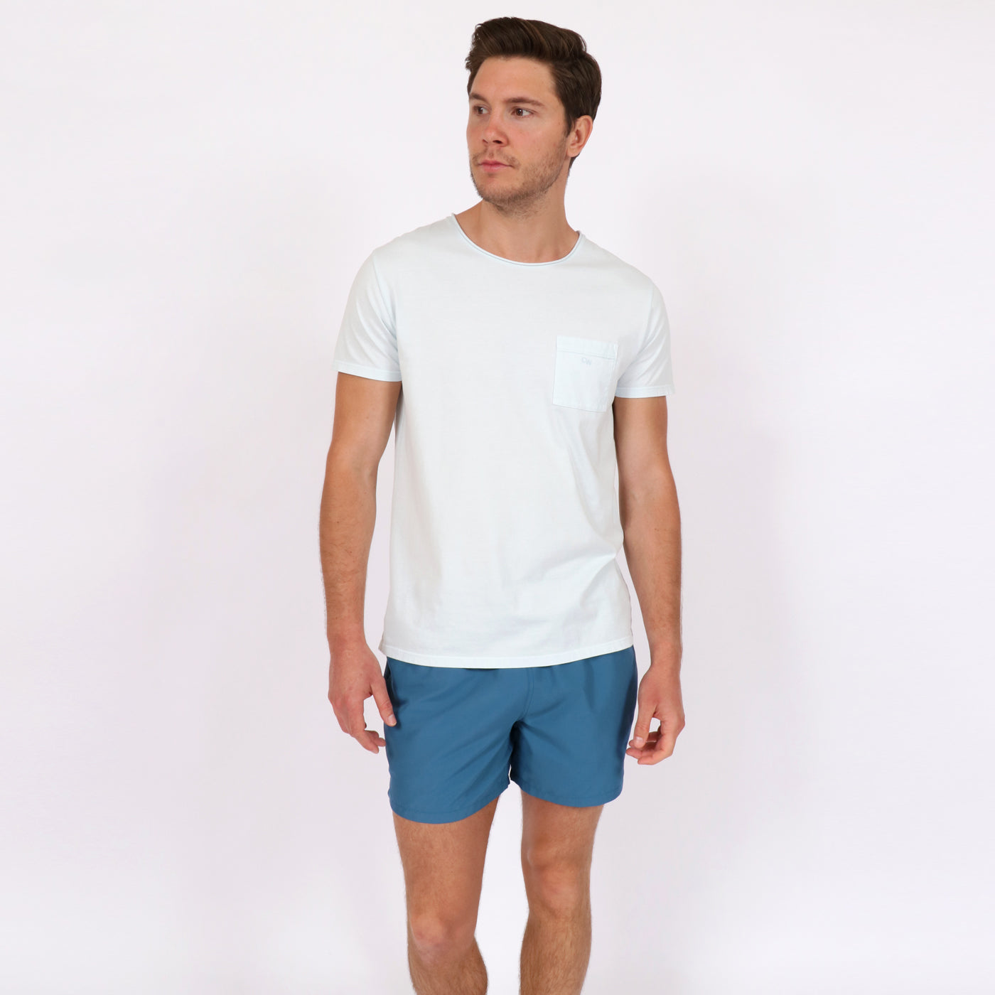 OWTS1804 Ice Blue garment dyed beach fit men's organic cotton t-shirt with chest pocket detail styled with OWSS1801 Aegean blue men's recycled polyester swim short