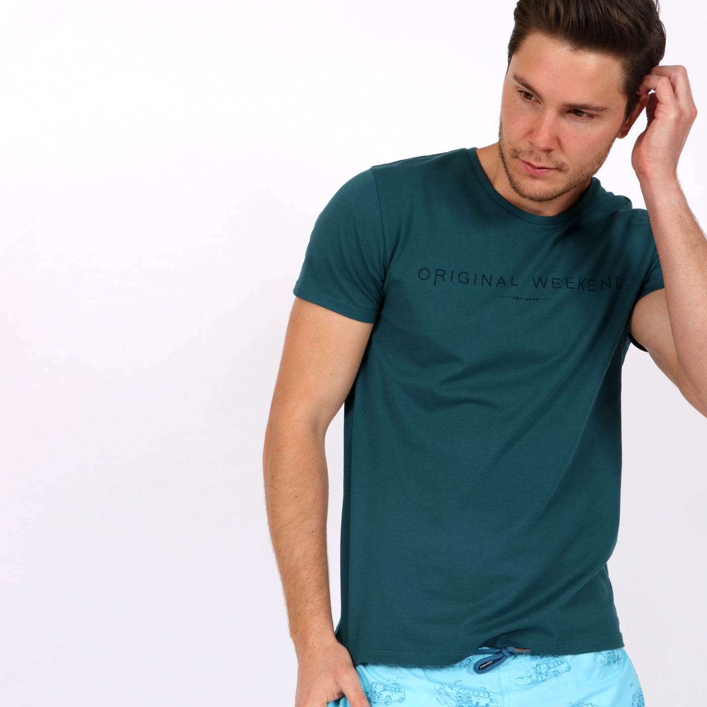 OWTS1802 Atlantic Green men's organic cotton t-shirt with logo print on body front view styled