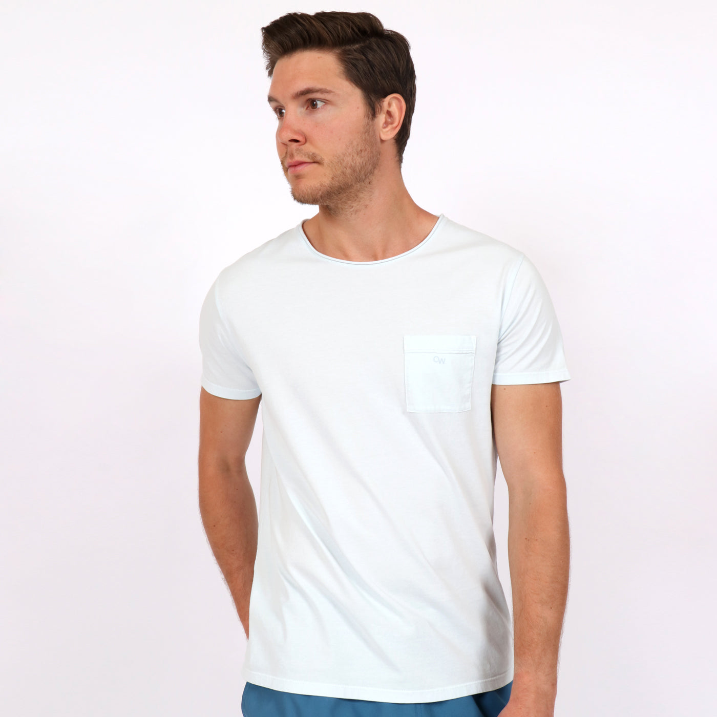 OWTS1804 Ice Blue garment dyed beach fit men's organic cotton t-shirt with chest pocket detail on body front view
