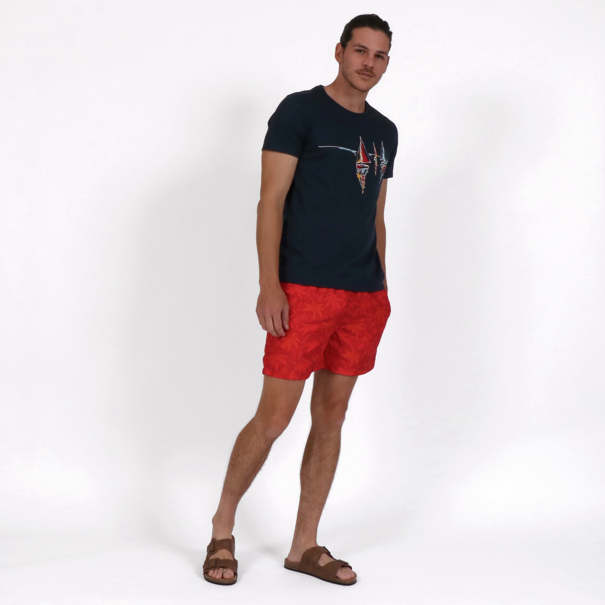 OWTS2202 MIDNIGHT NAVY SAIL PRINT MEN'S ORGANIC COTTON T-SHIRT OUTFIT WITH RED WILD FLOWER MENS SWIM SHORT